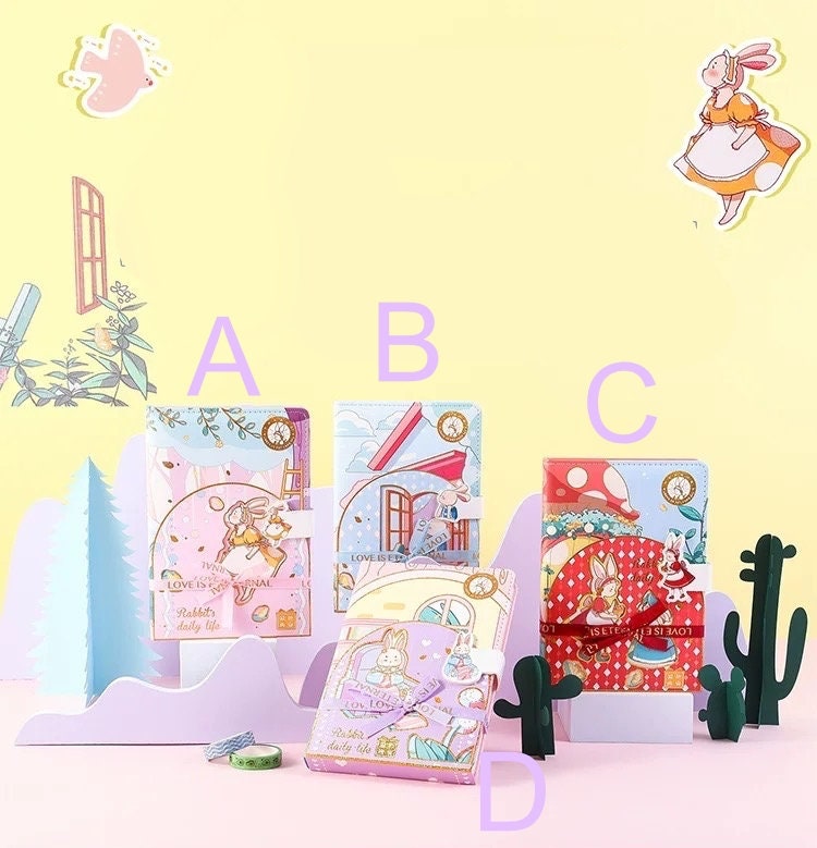 Rabbit's Daily Life Leather Journal - Magnetic Buckle, kawaii design, displayed on a pastel backdrop with playful cartoon rabbit illustrations. Features four variations labeled A, B, C, and D. Ideal for cute stationery collection.