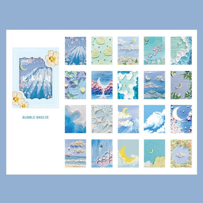 Rainbow Dream Decorative Scrapbook Paper - 60 Pages featuring various pastel designs of clouds, moons, and flowers in blue and pink color palettes, perfect for kawaii-themed scrapbooking.