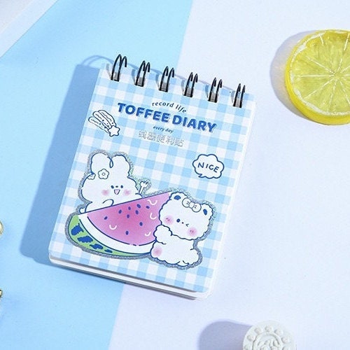 Toffee Diary Decorative Sticky Notepad Memo Pad featuring cute kawaii bear characters and watermelon design on a blue checkered cover with spiral binding