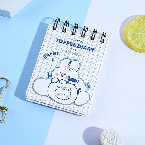 Toffee Diary Decorative Sticky Notepad Memo Pad with cute rabbit design in kawaii style, spiral-bound, grid pattern.