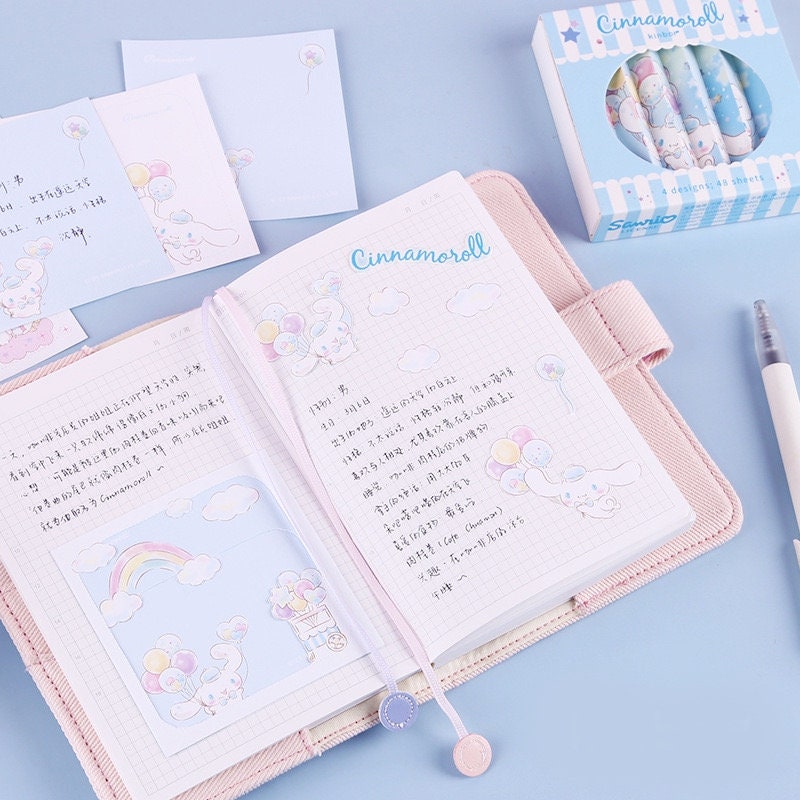 Cinnamoroll Notepad Set - 4 Designs, 48 Pages, featuring cute pastel illustrations of Cinnamoroll and balloons, displayed with notepad sheets, an open notebook, and a pen on a light blue background. Perfect for kawaii stationery lovers.