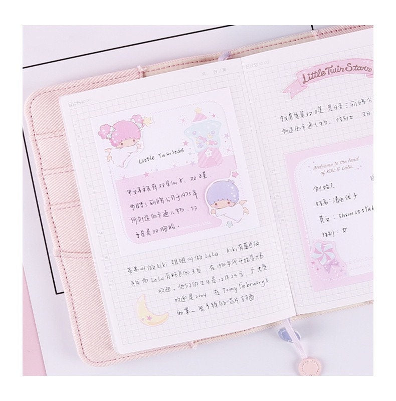 Cinnamoroll Notepad Set - 4 Designs, 48 Pages shown open with cute kawaii illustrations and grid notes, featuring pastel colors and adorable characters.