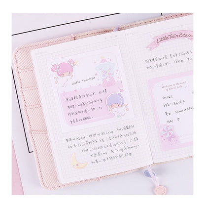 Cinnamoroll Notepad Set - 4 Designs, 48 Pages shown open with cute kawaii illustrations and grid notes, featuring pastel colors and adorable characters.