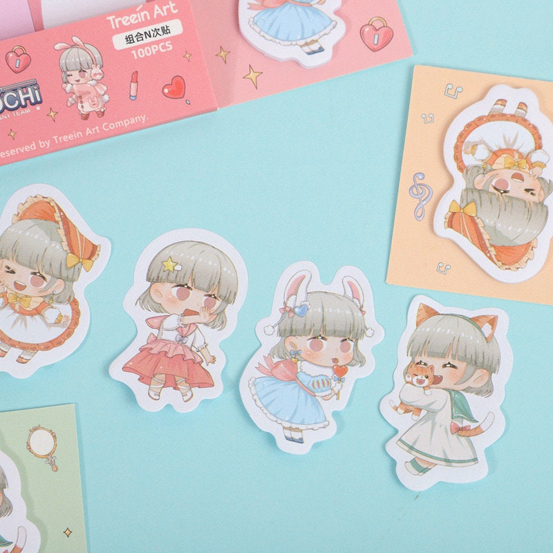 Mochi Sticky Notes Set features 100 kawaii Post-it labels and tags with adorable girl characters in various costumes including bunny ears, fox outfit, and fairy tale dresses, perfect for cute stationery lovers.