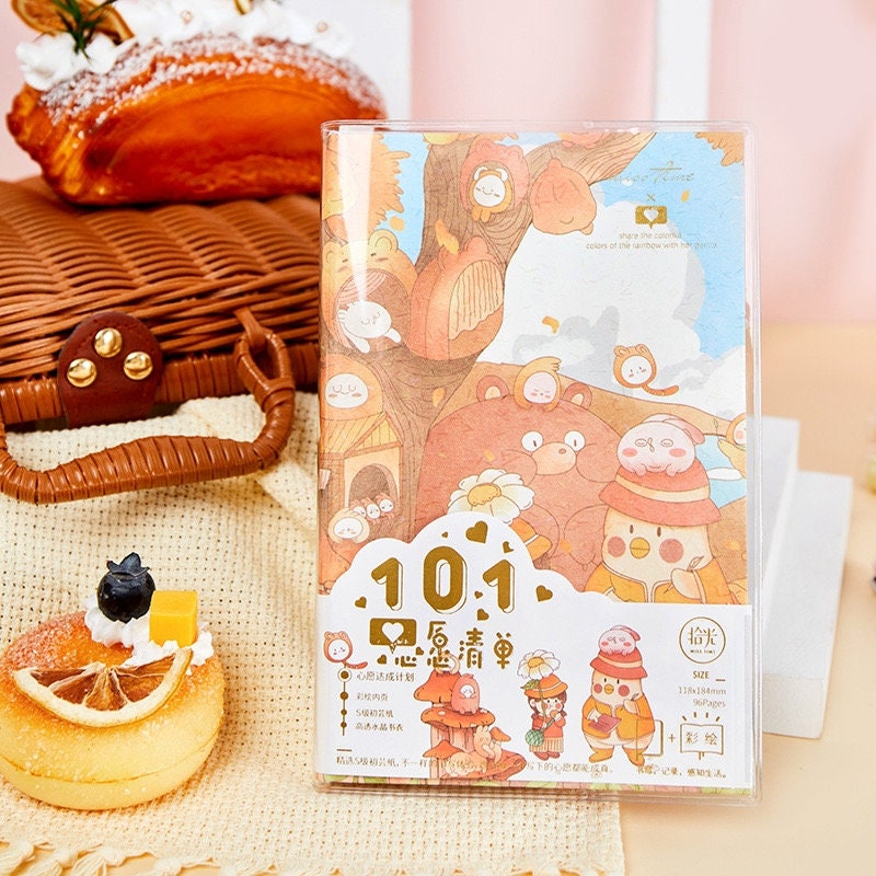 Crystal Cover Rainbow Town Journal - 192 Pages A5 featuring a colorful illustration of cute kawaii characters in a whimsical town setting.