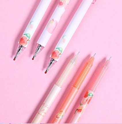 Peach Scented 0.5mm Kawaii Gel Pen featuring cute peach designs on a pink background.