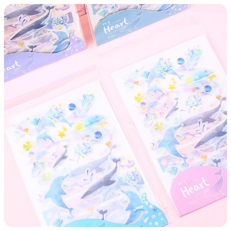 Kawaii Dolphin Ocean Stickers Set with 20 Designs featuring cute dolphins, starfish, corals, and sea life in pastel colors. Perfect for decorating planners, journals, and scrapbooks.