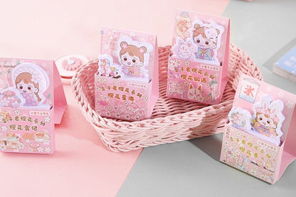 Kawaii Girl Sticky Notepad - 60 Pages featuring cute pastel designs in a pink basket, ideal for notes and reminders, kawaii stationery for school or office.