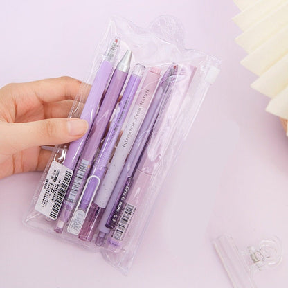 Kawaii Black Ink Gel Pens Set - 0.5mm in Purple Packaging, held by a hand.