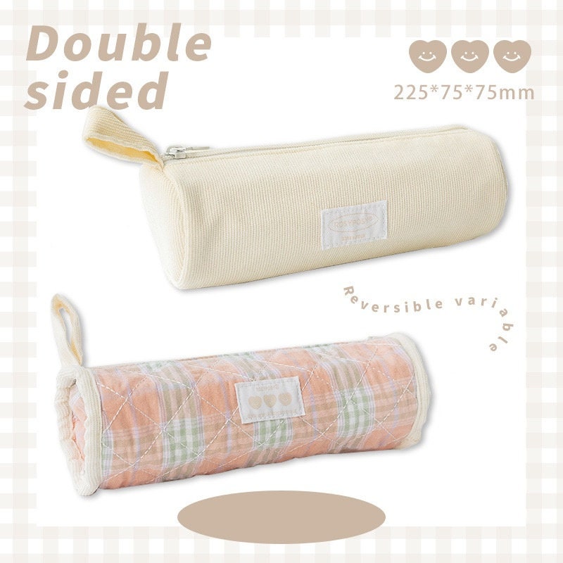 Double-sided milky cream fabric pencil case, reversible design with a soft cream side and a pastel plaid pattern side, kawaii stationery holder with zipper closure, 225x75x75mm.