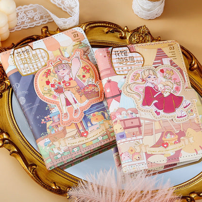 Blue Flower House Leather Journal - A6, 192 Pages featuring cute kawaii illustrations, displayed on a vintage gold tray with lace and delicate ornaments.