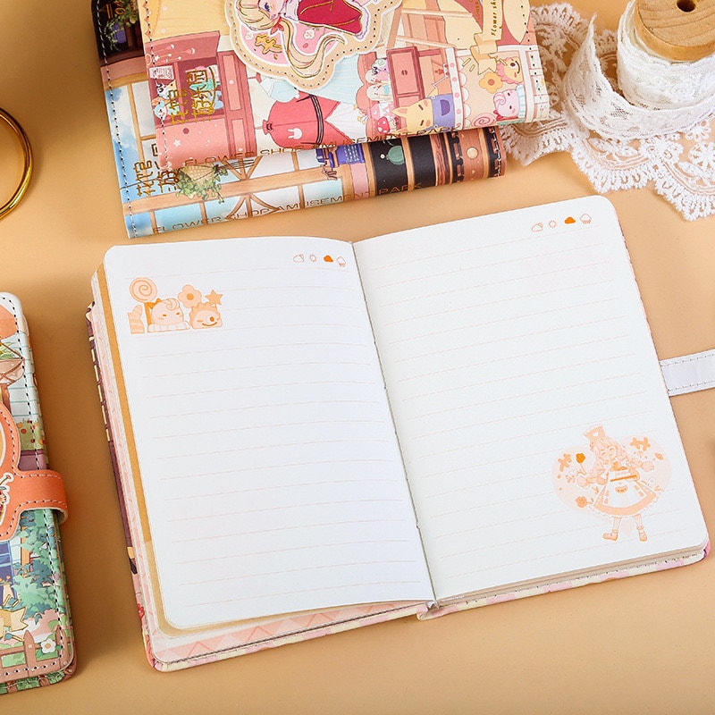 Blue Flower House Leather Journal in A6 size with 192 pages, open to show lined pages with cute kawaii illustrations, surrounded by other colorful journals on a beige surface.