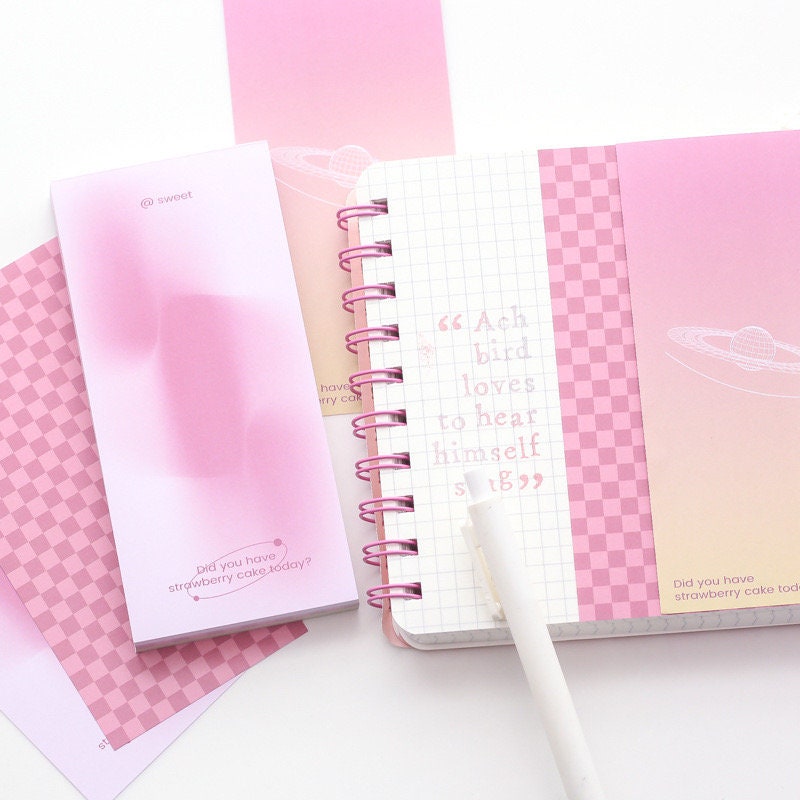 Dreamy Island Notepad Set with 90 sticky notes in pastel pink and purple hues, featuring cute designs and inspirational quotes.