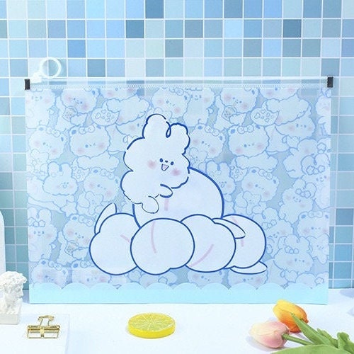 Kawaii Toffee Diary A4 Zip Document Bag featuring a cute poodle design on a blue background with cartoon illustrations, perfect for storing school or office supplies.