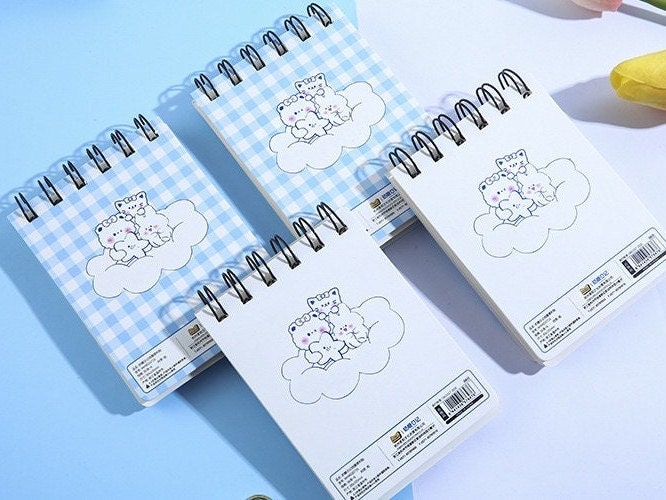 Toffee Diary Decorative Sticky Notepad Memo Pad featuring cute white bear on a cloud, spiral-bound, in blue gingham and plain white designs, kawaii stationery.