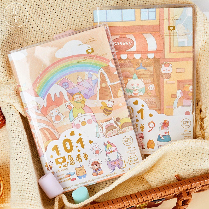 Crystal Cover Rainbow Town Journal - 192 Pages A5 featuring cute kawaii characters in a colorful rainbow town scene with playful animals and charming buildings, perfect for notes and sketches.