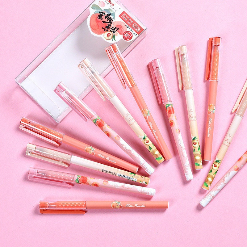 Peach Scented 0.5mm Kawaii Gel Pen with cute peach-themed designs on a pink background, perfect for adding a fruity touch to your writing collection.