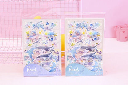 Kawaii Dolphin Ocean Stickers Set - 20 Designs in packaging, featuring adorable dolphin and marine-themed stickers in pastel colors.