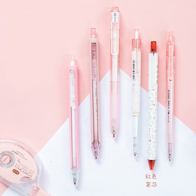 Kawaii Black Ink Gel Pens Set - 0.5mm, featuring six pastel-colored pens and a roll of correction tape on a pink and white background.