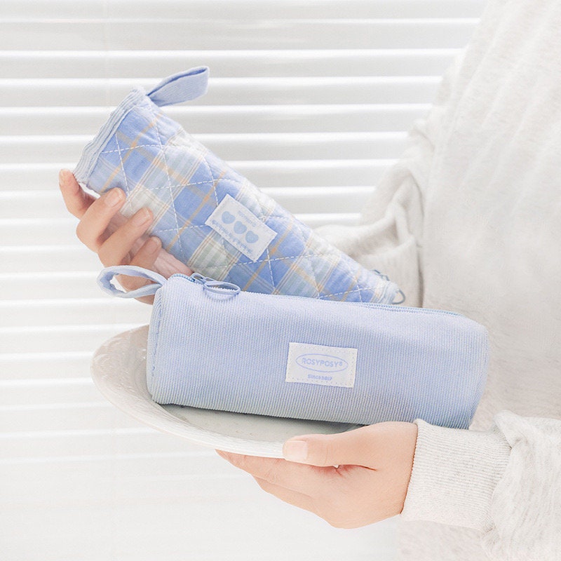 Double-sided milky cream fabric pencil case in light blue, featuring a quilted design and checkered pattern.