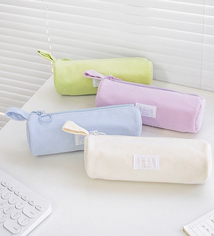 Double-sided milky cream fabric pencil case in pastel colors, kawaii stationery accessory, durable and stylish school supply organizer, four colors: green, pink, blue, and white.