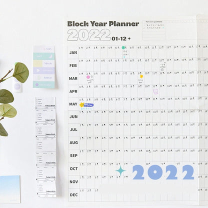 2022 yearly planner - goal tracker and organizer with minimalist design, featuring monthly blocks, cute stickers, and notes sections, perfect for productivity and planning needs.