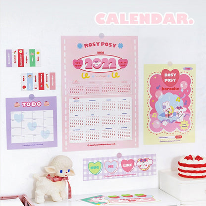 2022 Goal Tracker Calendar with Stickers, kawaii-style, featuring pink and purple themed pages, cute animal illustrations, and colorful stickers for planning and organization.