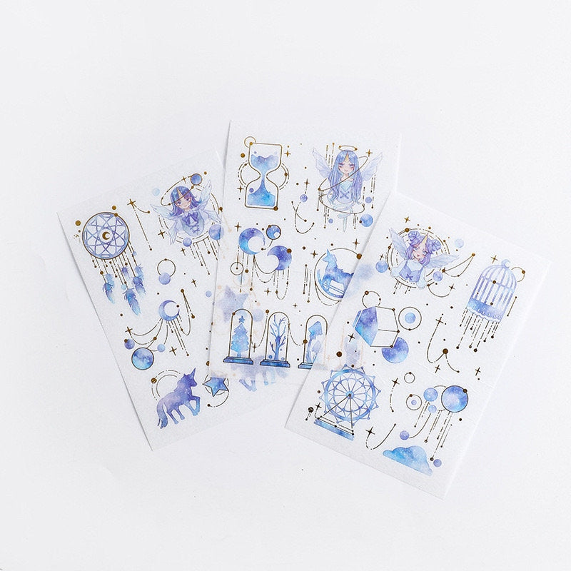 Dream Star Silver Foil Washi Sticker Set featuring celestial and mystical designs, including stars, moons, dream catchers, unicorns, hourglasses, and fairies in watercolor blue tones with silver foil accents. Kawaii stationery.