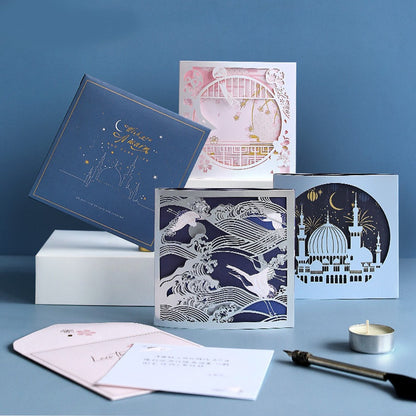 3D Starlight Studio Pop Up Card for All Occasions featuring intricate designs including celestial themes, ocean waves, architectural elements, and cherry blossoms; perfect for birthdays, anniversaries, or any special event; includes envelopes and greeting inserts.