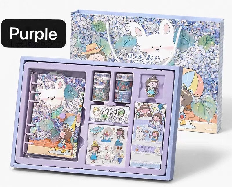 Dorothy Planner Gift Set in Purple - Includes kawaii journal with rabbit and girl illustrations, decorative stickers, washi tape, and additional planner accessories in a cute themed presentation box.