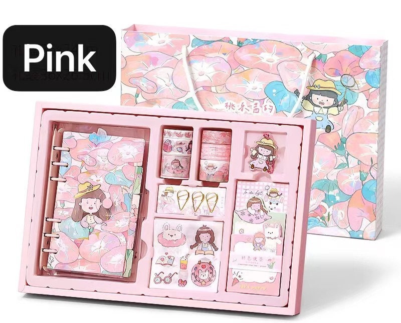 Dorothy Planner Gift Set in pink includes a kawaii journal, decorative stickers, and washi tape, all featuring adorable illustrated designs. Perfect for cute stationery enthusiasts and planning activities.