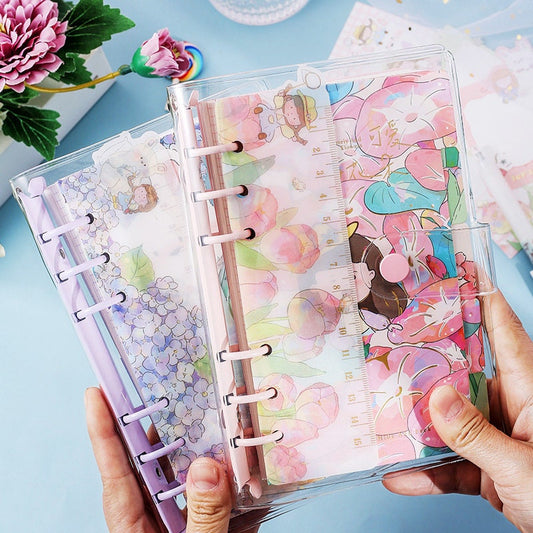 Dorothy A6 Loose Leaf Notebook with Ruler, kawaii style, cute floral and character cover designs, pastel colors, translucent cover, used for journaling and note-taking.