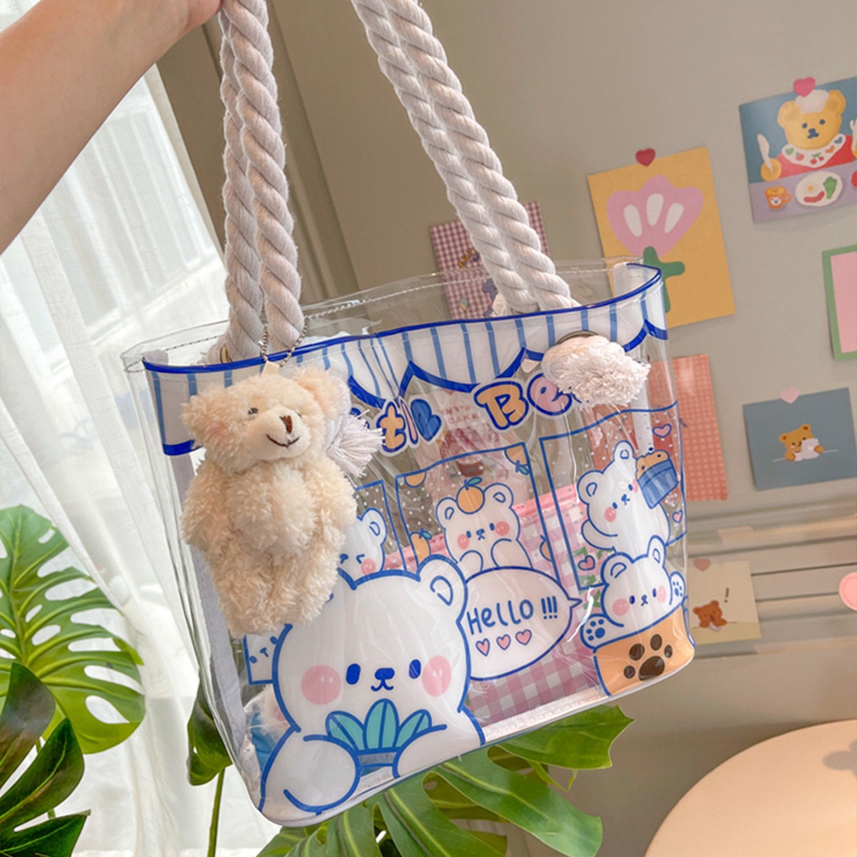 Clear vinyl tote bag with animal design, featuring cute bear illustrations and white rope handles.