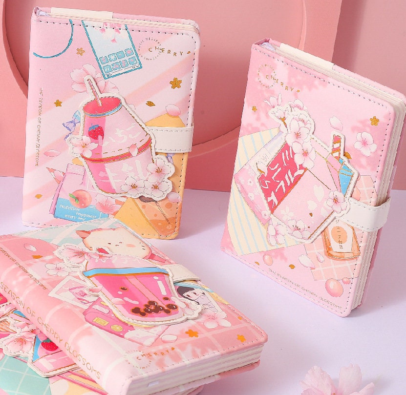 Pink Dessert Leather Journal with Magnetic Buckle featuring kawaii cherry blossom and dessert-themed illustrations.