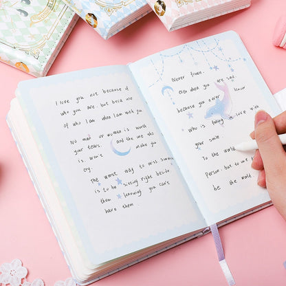 Alice Dream Journal with gold foil leather cover, featuring open pages with handwritten inspirational quotes, pastel illustrations, and a hand holding a pen, perfect for capturing thoughts and dreams