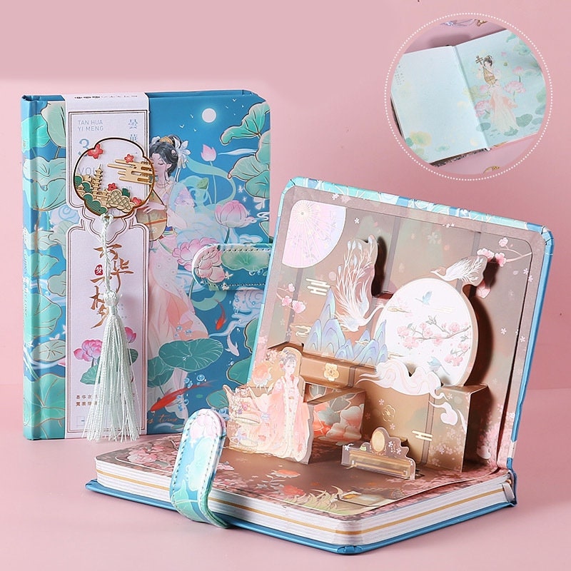 Pink Ancient Asian Beauty Planner with Metal Bookmark featuring delicate illustrations, a floral design, pop-up scenes, and a intricate tassel charm, perfect for kawaii stationery lovers.