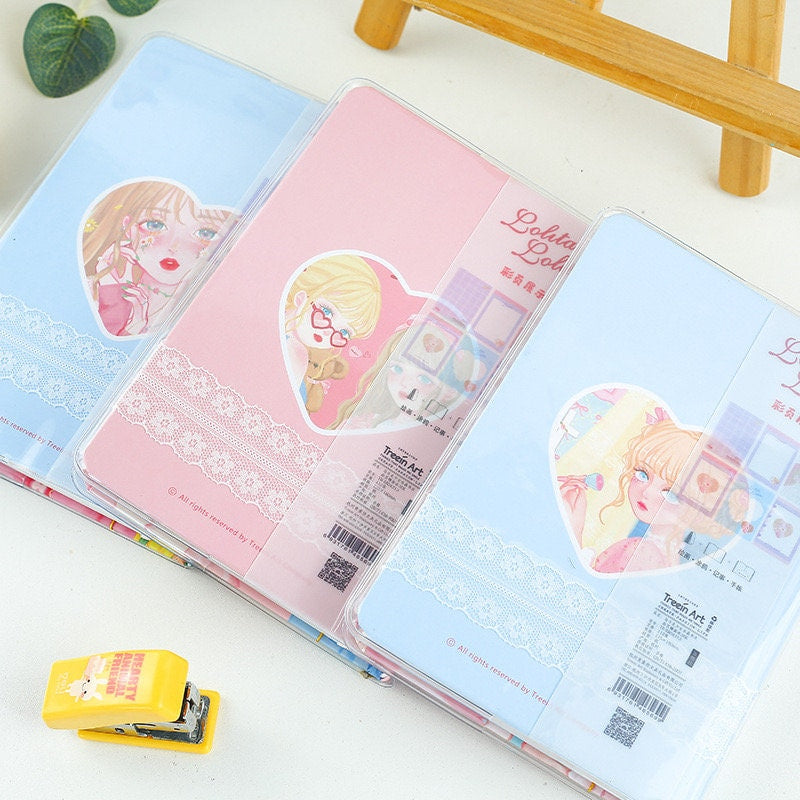 Fashion Macaron Girl Notebook with Bookmark and Buckle in pastel colors featuring cute anime girl illustrations, lace detailing, and secure buckle closure for kawaii stationery enthusiasts.