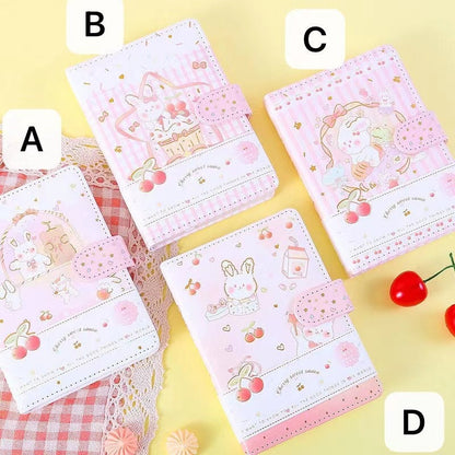 Pink Cherry Sauce A6 Journal with Magnetic Buckle featuring cute kawaii rabbit and cherry designs displayed in four different variations labeled A, B, C, and D on a yellow background.