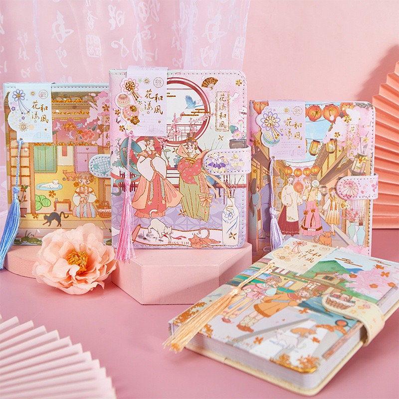 Cherry Blossom Planner - Soft Leather, Magnetic Buckle; kawaii style with beautiful floral and scenic illustrations, tassels, and pastel colors; ideal for journaling and organization.