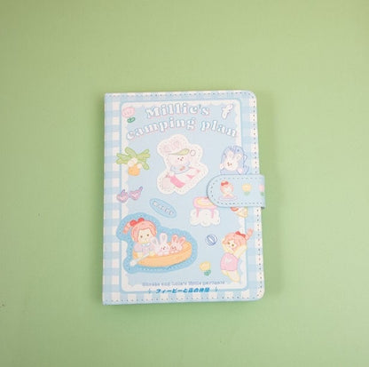 Millie's Leather Camping Journal with Colorful Pages featuring cute illustrations on a blue checkered cover and snap closure.