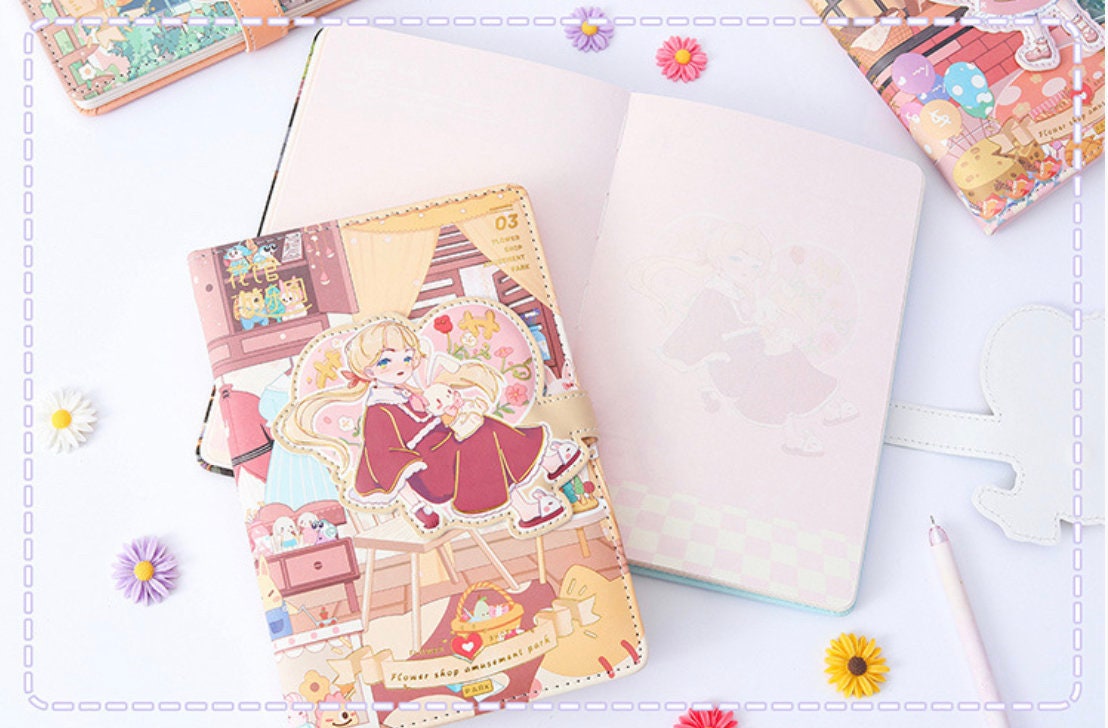 Magnetic Buckle Flower House Leather Journal showcasing whimsical kawaii design with a girl and bunny illustration, surrounded by flowers and stationary items.