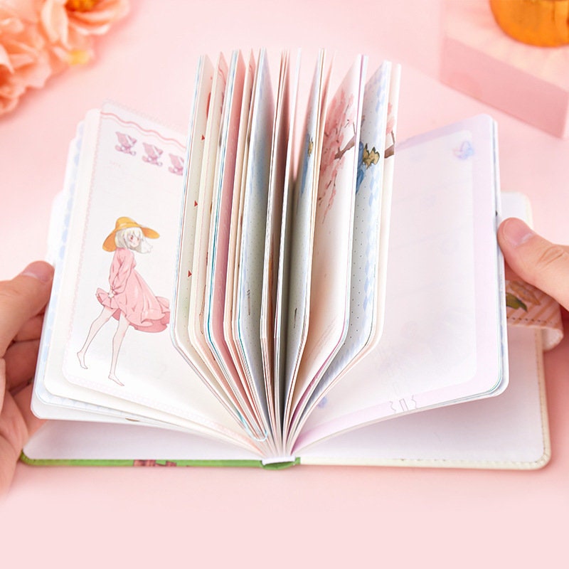 Colorful Page Leather Journal with Magnetic Buckle - A5 size, featuring kawaii-style illustrations and aesthetic designs.