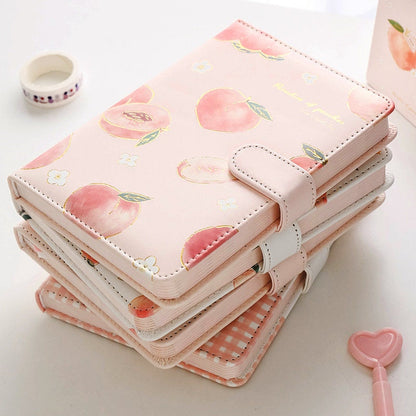 Peach Leather Planner in Pink A5 with Magnetic Closure, 228 Pages, featuring cute peach designs and a heart-shaped pen.