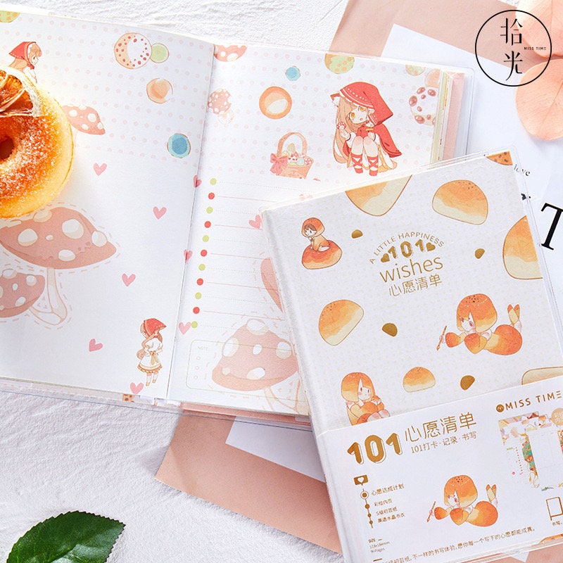 Kawaii-themed Once Upon a Time Crystal Cover Journal featuring adorable illustrated characters and whimsical mushroom designs on the pages, ideal for note-taking and writing diaries.