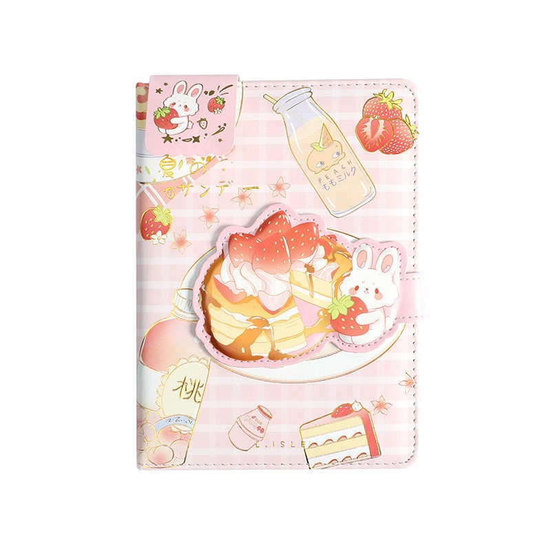 Kawaii Summer Sundae Leather Journal with Magnetic Buckle featuring cute illustrations of a bunny, strawberries, and sweets on a pink checkered background.