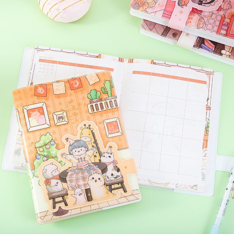 Pink Magnetic Buckle Happiness Planner with A5 PVC Cover featuring cute and colorful kawaii illustrations, ideal for organizing and planning.