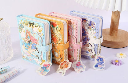 Kawaii A6 Shining Girl Leather Journals with Bookmarks in pastel blue, orange, pink, and purple covers, displayed on a desk.