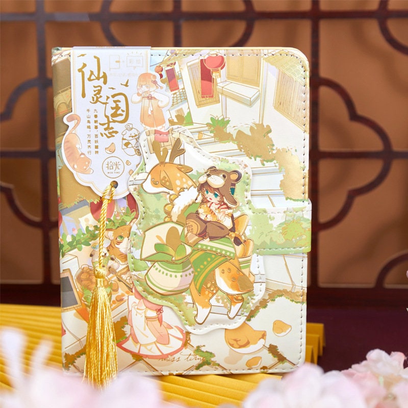 Magic World Leather Journal with colorful pages, featuring vibrant kawaii illustrations, magnetic buckle, and gold tassel bookmark.