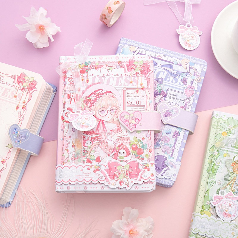 Colorful Princess SAKI A5 Journal with Magnetic Buckle in pastel pink, purple, and green designs, featuring adorable illustrations, heart-shaped embellishments, and floral accessories on a pink background.