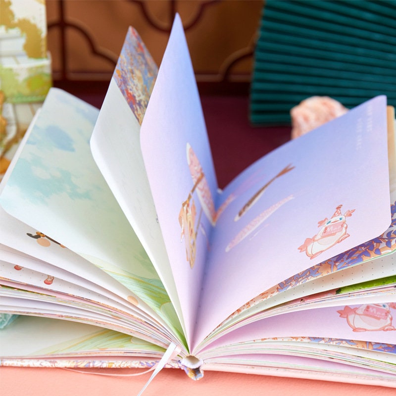 Magic World Leather Journal with colorful pages and magnetic buckle, featuring whimsical illustrations and vibrant designs.